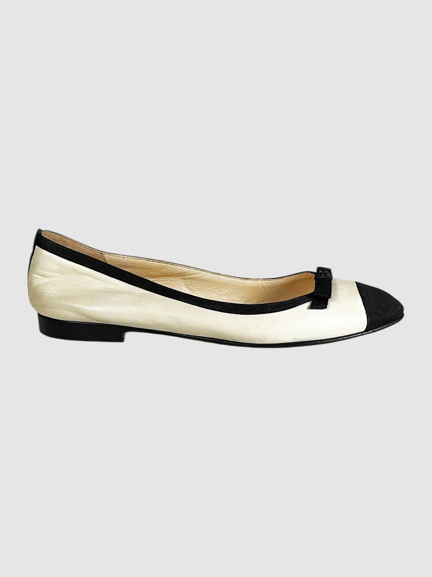 Chanel Cream and Black Leather Bow Detail Cap Toe Flats - Size 38 luxury designer resale consignment secondhand Toronto
