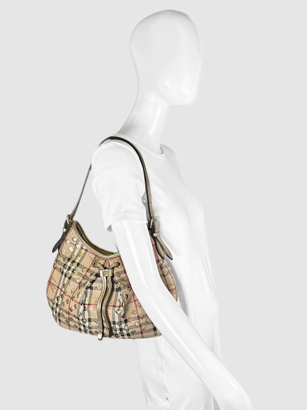 Burberry Beige, Black, White, Red, and Gold-Tone Coated Canvas and Leather Haymarket Check Drawstring Hobo Bag Luxury Designer Resale Consignment Toronto