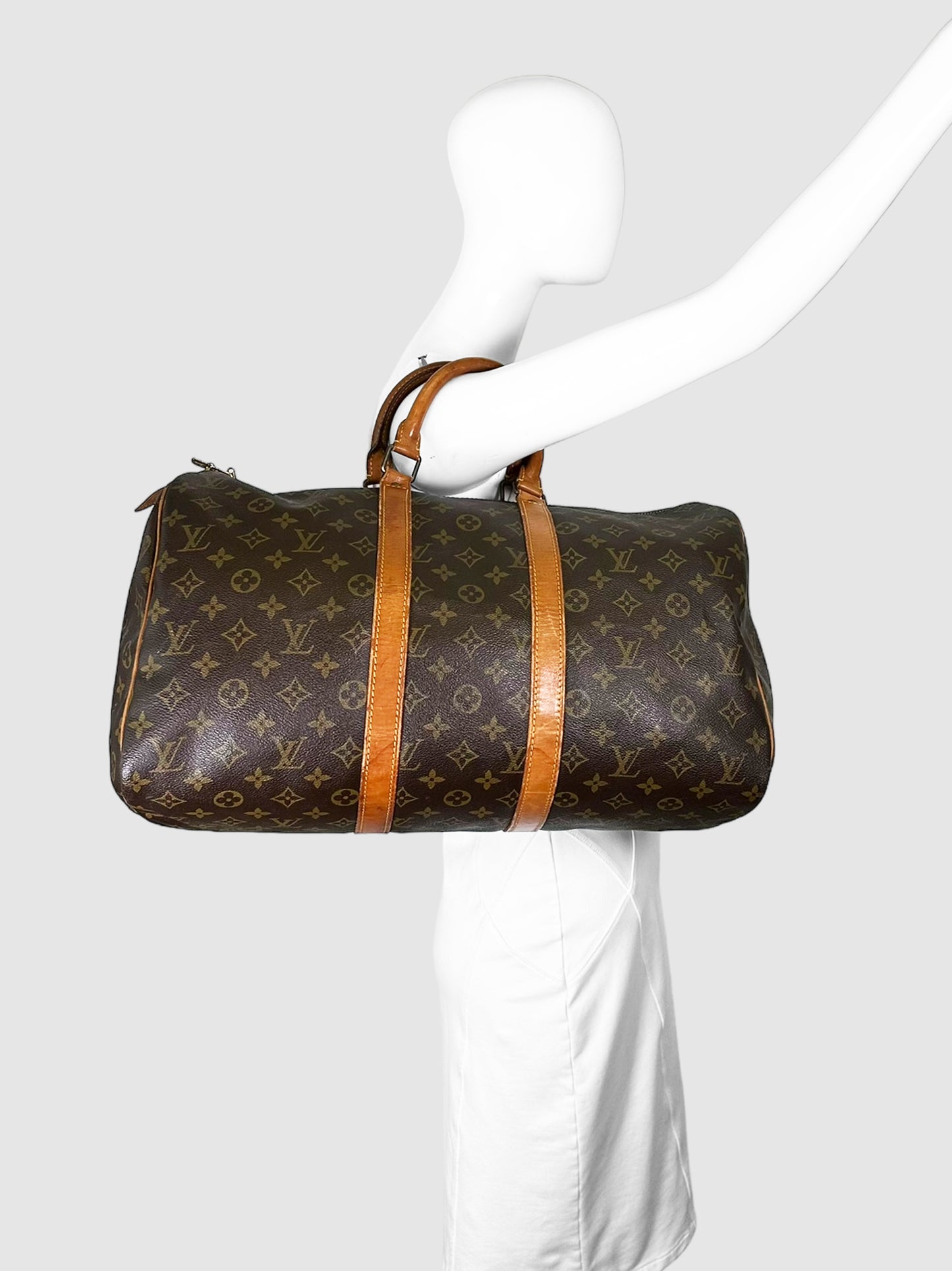 Louis Vuitton Brown Monogram Canvas Keepall 45 Duffle Bag with Cowhide Leather Trim Consignment Secondhand Designer Luxury Resale Toronto Trendy