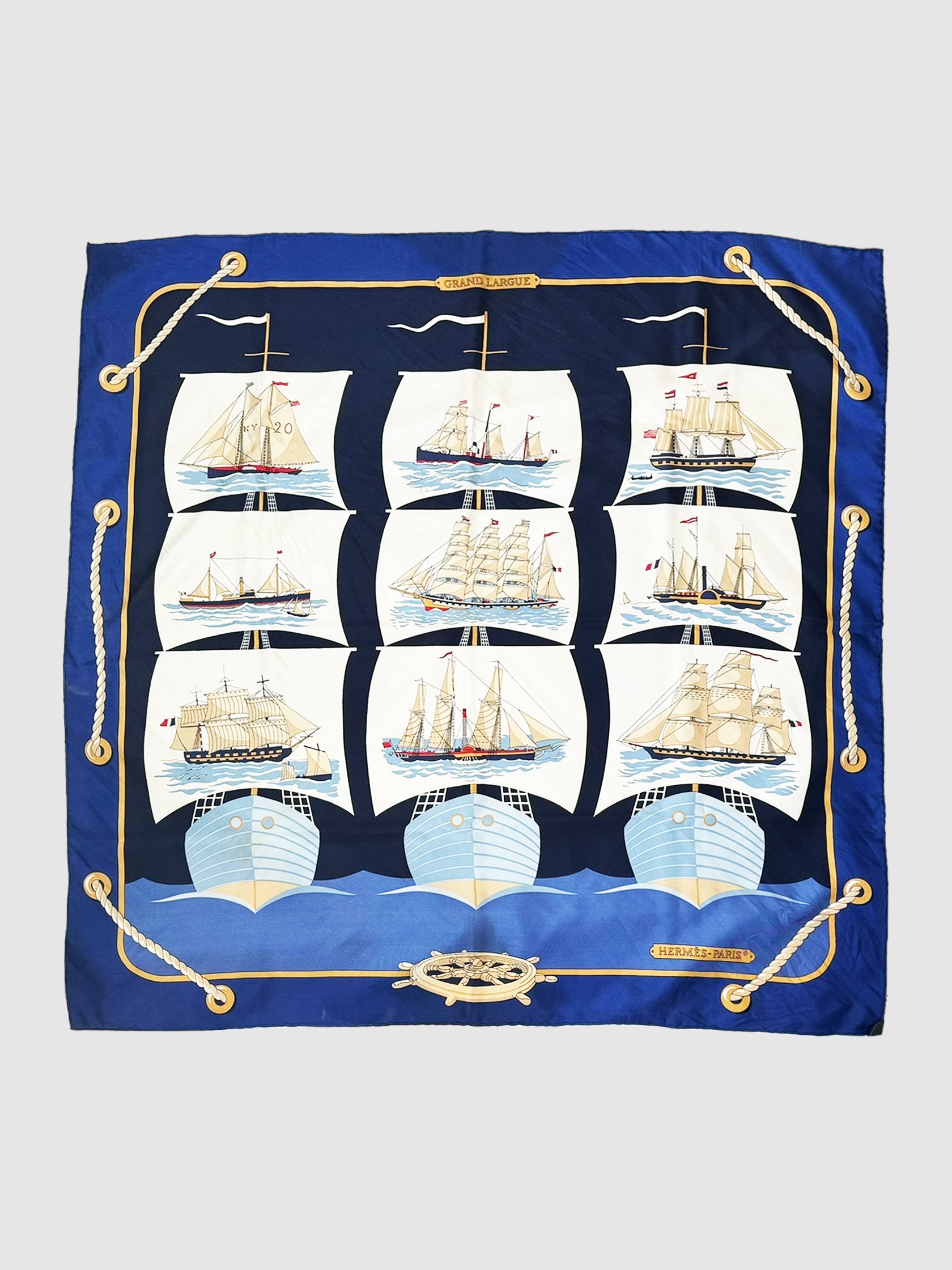 Hermès 1979 "Grad Largue" Blue Silk Scarf.
Designed by Pierre Peron
Sailboats Nautical Scarf
Luxury Consignment Designer Resale Secondhand Toronto